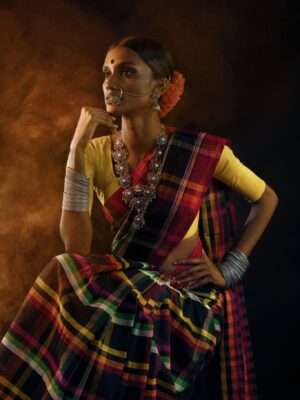 Captivating portrait of an Indian woman in traditional saree, showcasing cultural elegance and style.